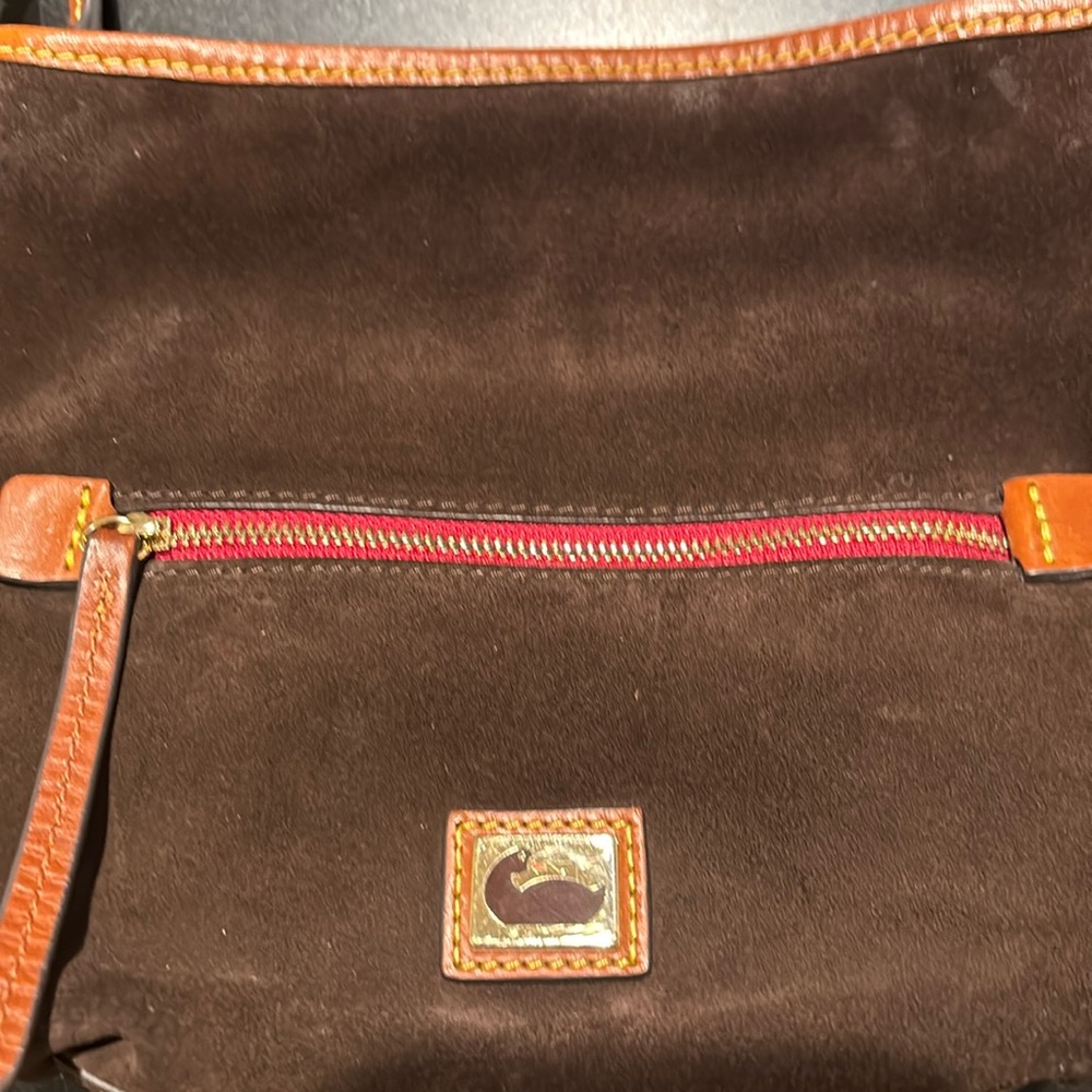 Dooney and Bourke brown suede Hobo. 15" wide 13" high and 5" depth. Handle 10"